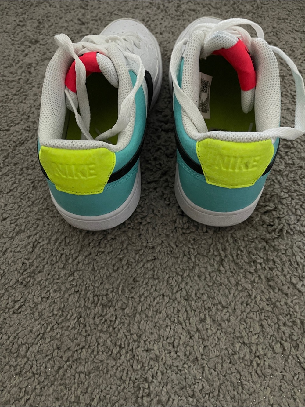 Nike White Low-Top Sneakers with Black Swoosh and Teal Heel - Picture 2 of 4